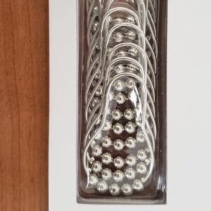 Shower curtain rings - still in the package - never used.